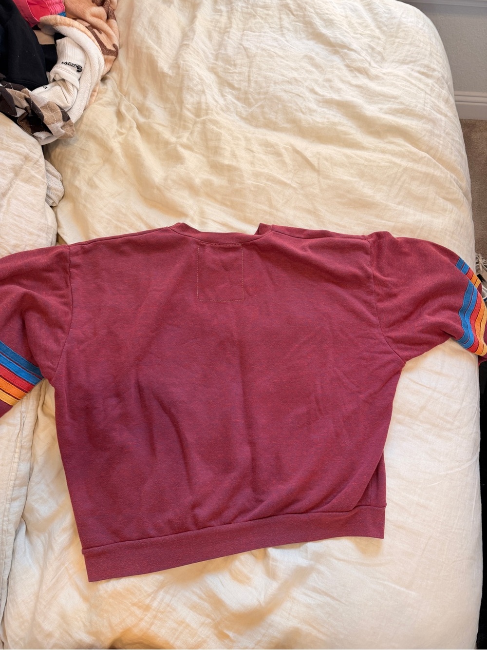 women’s Maroon Crewneck Sweater with Multicolor Stripe Sleeves - Picture 3 of 4